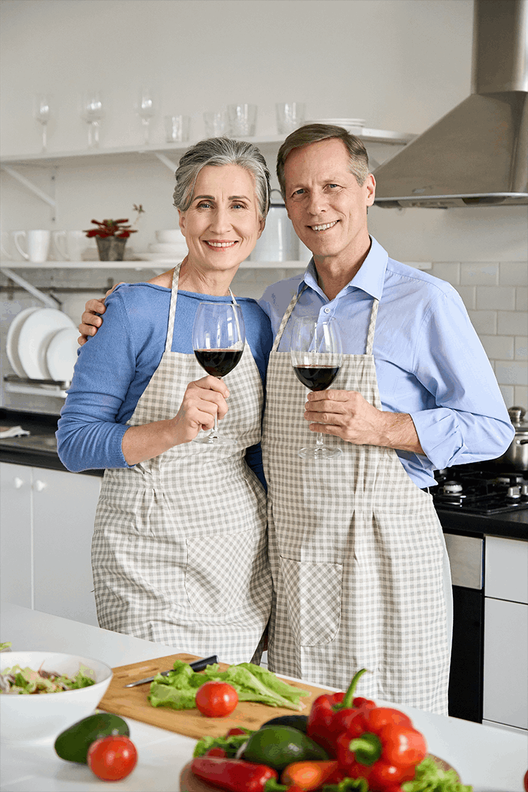 Happy older mature family having breakfast