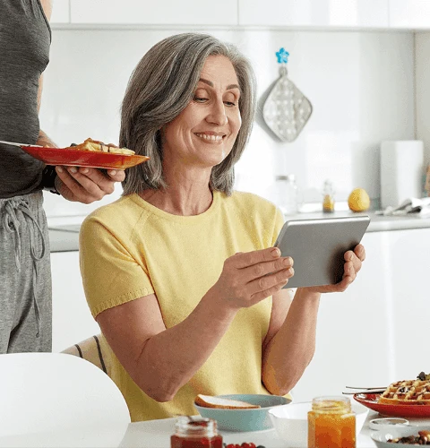 Happy older mature family having breakfast